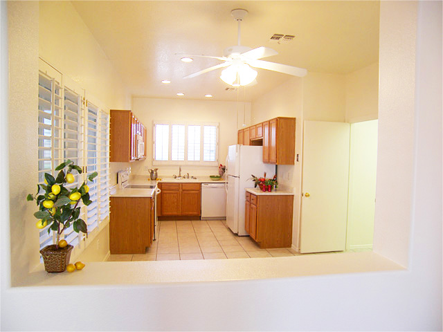 Tiled dining room and kitchen with wooden plantation shutters